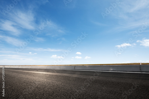 empty asphalt road with snow mountains