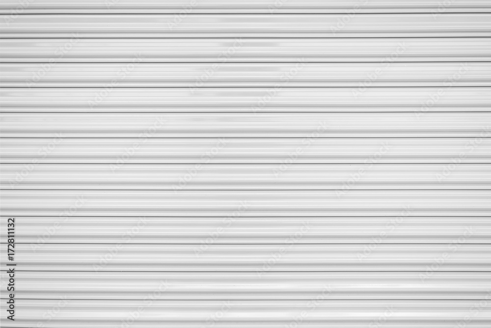 The texture of corrugated metal sheet, white or gray galvanizes steel rolling shutter. The texture of corrugated metal sheet, white or gray galvanizes steel rolling shutter.