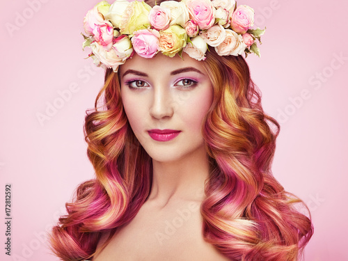 Beauty fashion model girl with colorful dyed hair. Girl with perfect makeup and hairstyle. Model with perfect healthy dyed hair. Flower wreath on head