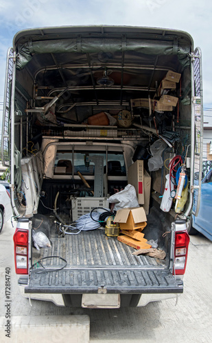 The cargo space of lorry with tools. Equipment craftsman in a pickup. Car with tools for repair and construction.