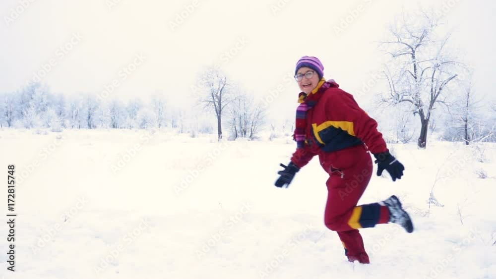 Happy woman running on winter landscape Happy woman running on winter landscape