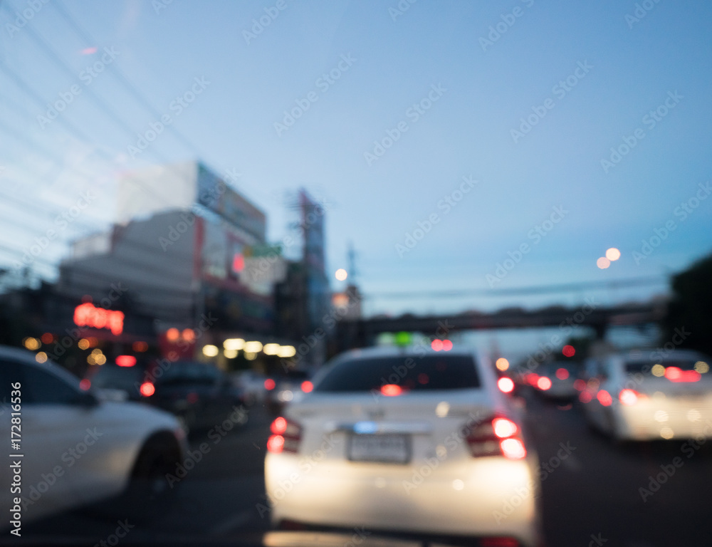 Blurred driving a car on traffic night