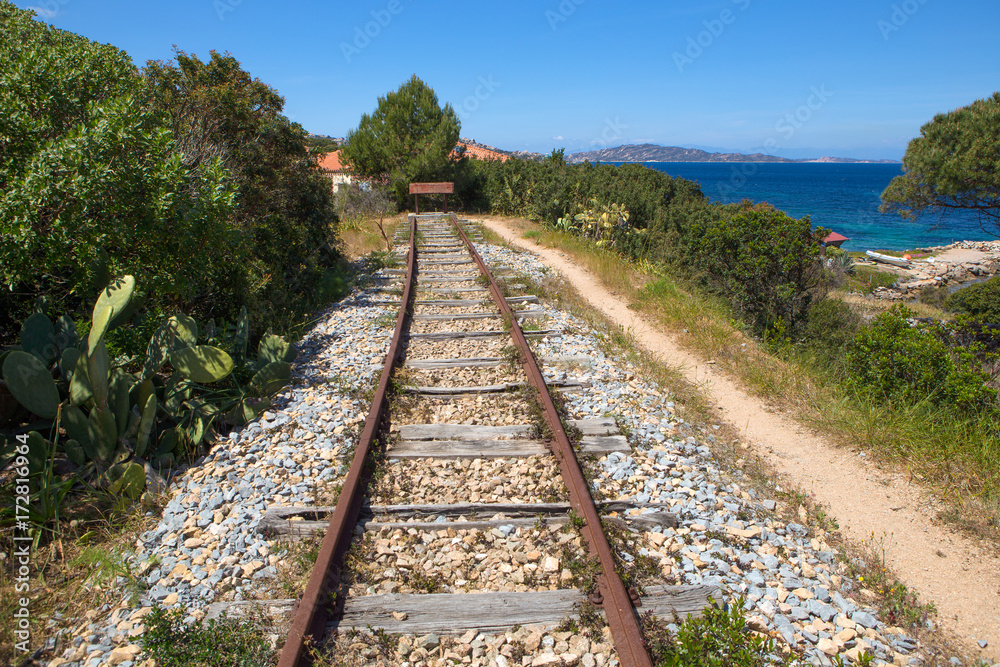 Fototapeta premium the end of a railroad near the sea