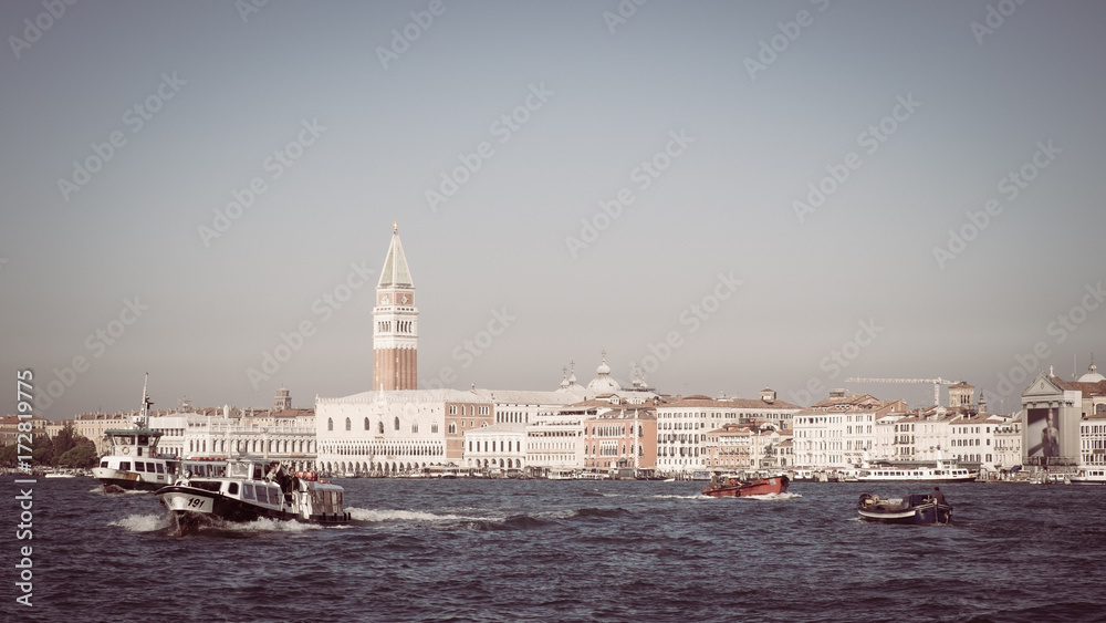 Bell tower of St Mark's Square and Doge's Palace Venice Italy with water taxi, Still life in Venice with a boat and Bell tower, Symbol of Venice vintage, Water taxi in Italy, Panorama of Venice