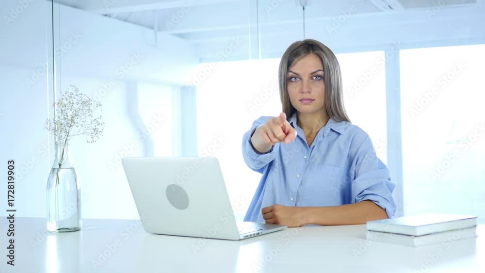 Woman Pointing at Camera in Office at Work Woman Pointing at Camera in Office at Work