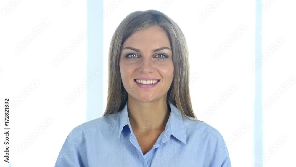 Portrait of Beautiful Smiling Woman Looking at Camera in Office Portrait of Beautiful Smiling Woman Looking at Camera in Office
