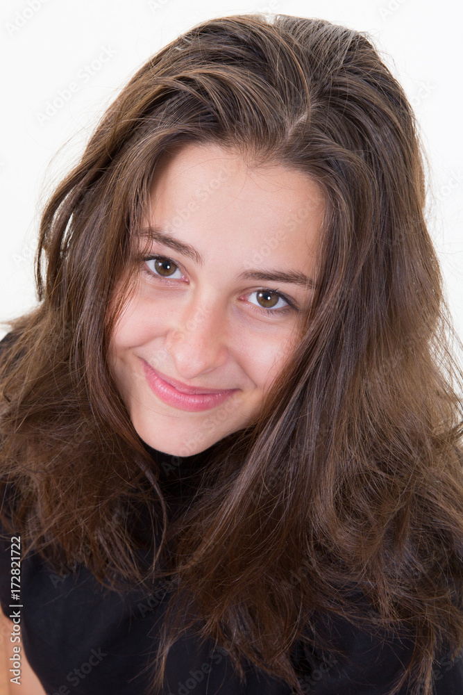 Portrait of a smiling happy woman looking at camera isolated on the white background Portrait of a smiling happy woman looking at camera isolated on the white background