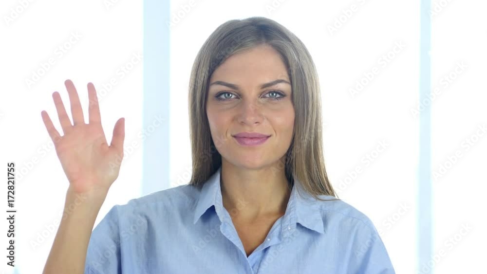 Portrait of Beautiful Young Woman Waving Hand to Welcome Portrait of Beautiful Young Woman Waving Hand to Welcome