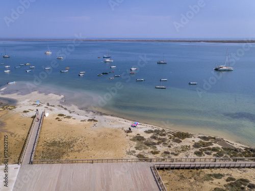 Aerial seascape, in Ria Formosa wetlands natural park, over Cavacos beach. Algarve.