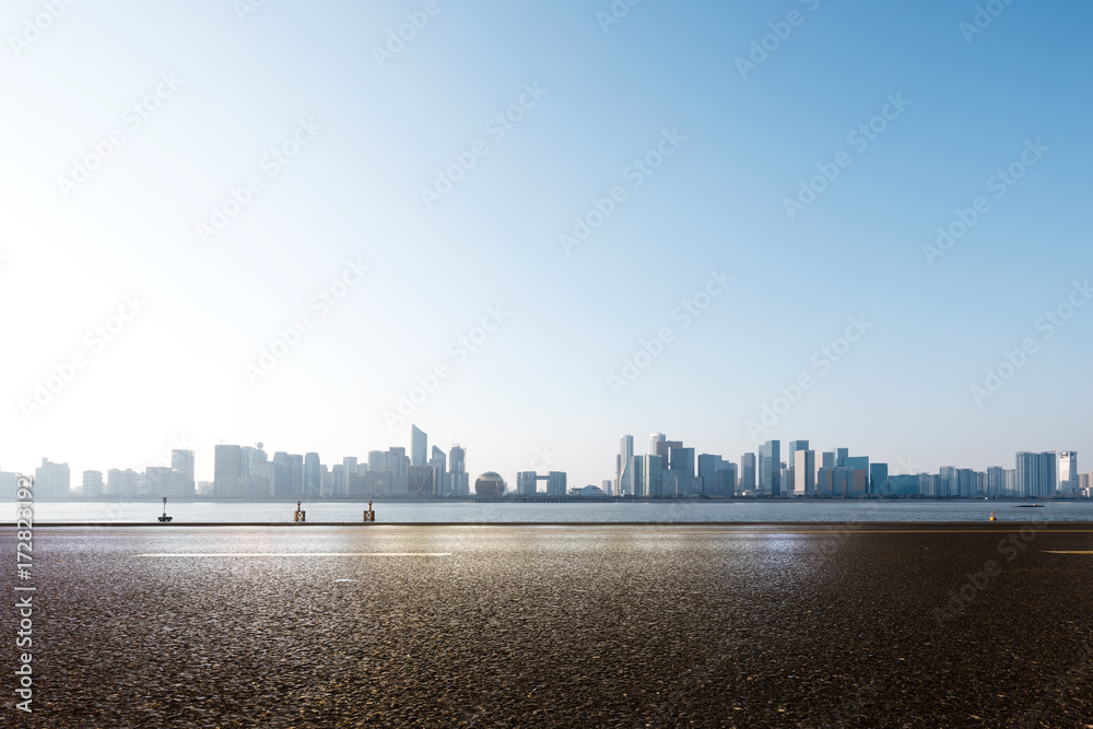 empty asphalt road with cityscape of modern city