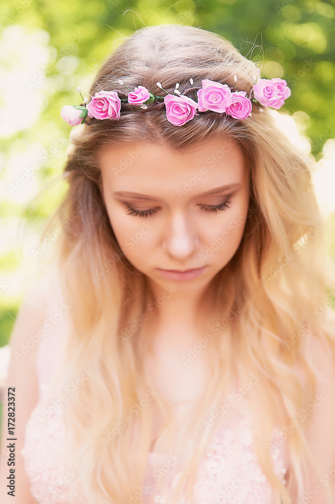 Naklejka premium Portrait of beautiful bride blonde in pink lace dress in the hair ornament handmade. Big facial