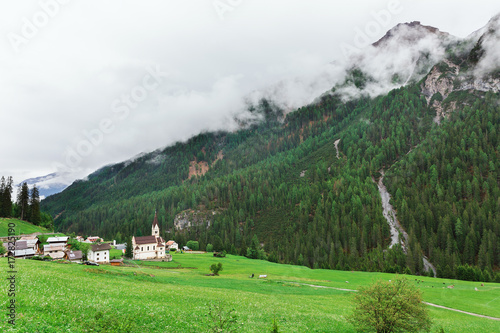 Church on the background of the Alps