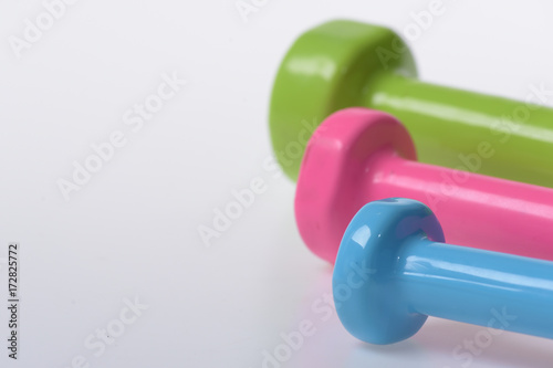 Sport regime symbols. Barbells in pink, green and blue colors