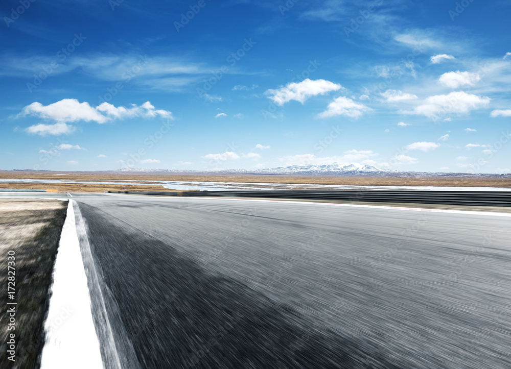 empty asphalt road with beautiful snow mountains