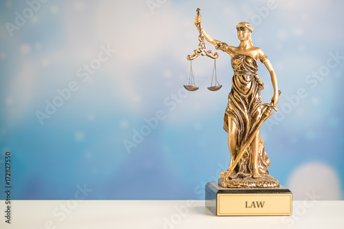 Fotografie Law and Justice symbol. blue sky background
