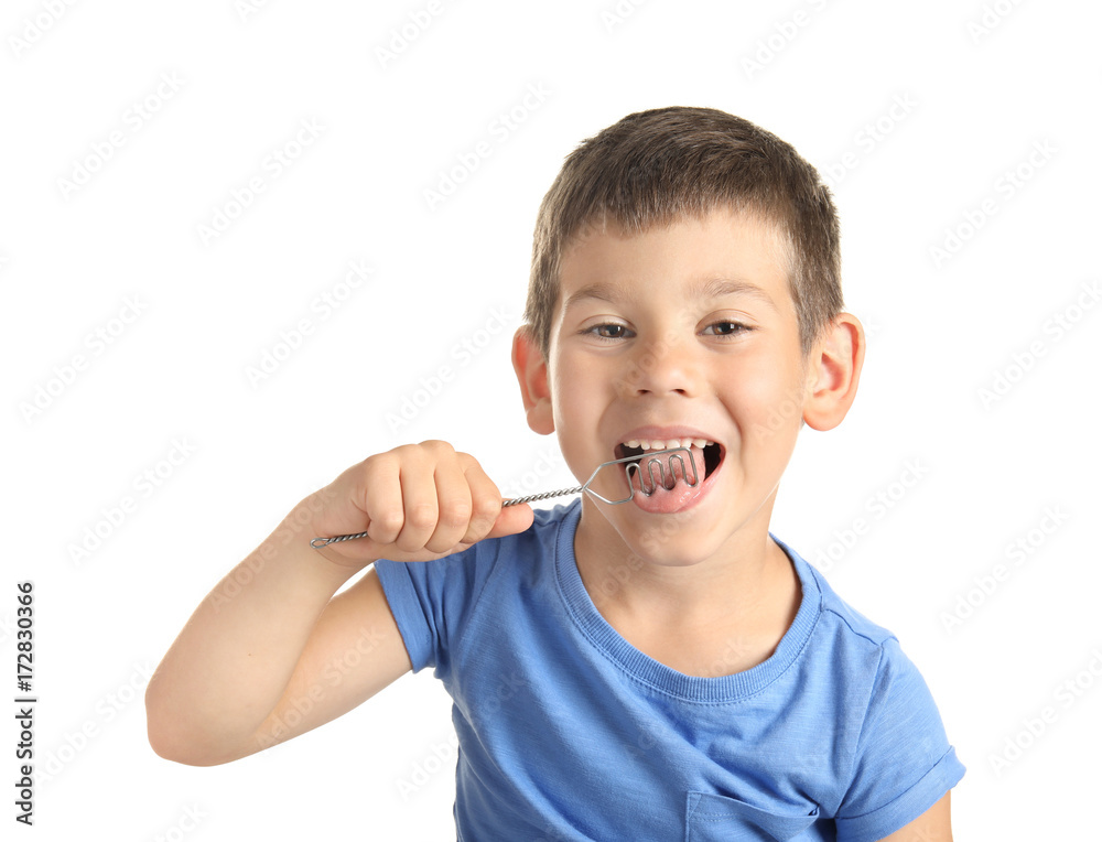 Cute boy with logopedic probe for speech correction on white background Cute boy with logopedic probe for speech correction on white background