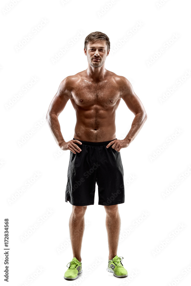 Portrait young sexy handsome man of strong athlete's body with bare torso. Posing on white studio background