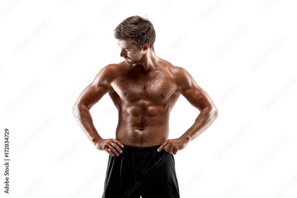 Portrait young sexy handsome man of strong athlete's body with bare torso. Posing on white studio background Portrait young sexy handsome man of strong athlete's body with bare torso. Posing on white studio background