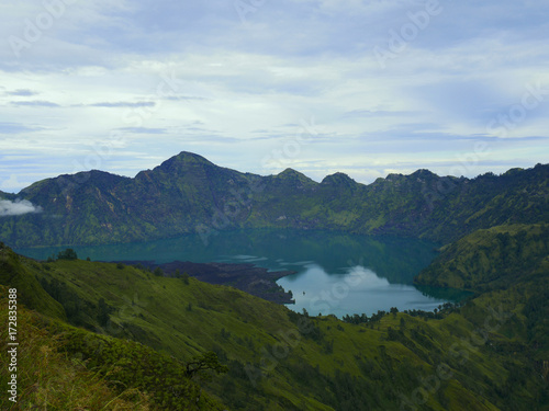 Beautiful green crater lake surrounded by green mountains in Rinjani, Lombok, Indonesia © orientalprincess310