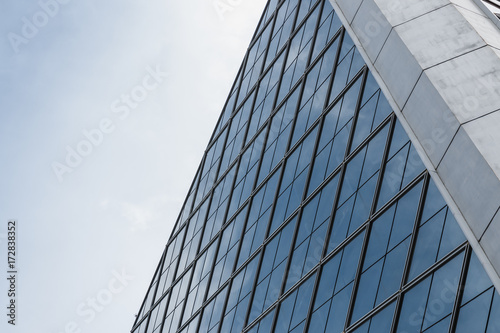 Architecture detail Modern with  glass  design  facade  of office building in bangkok