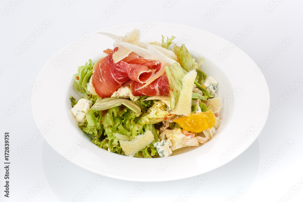 Restaurant food. Salad in a plate. Delicious food.