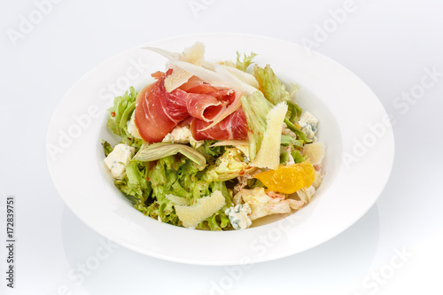 Restaurant food. Salad in a plate. Delicious food.