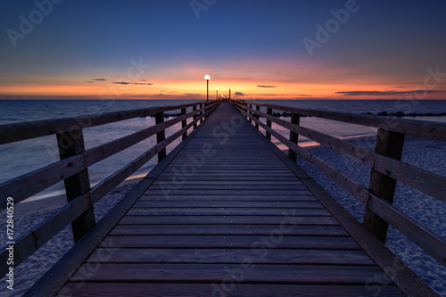 Fototapeta Naklejka Na Ścianę i Meble -  A sunset at the pier.