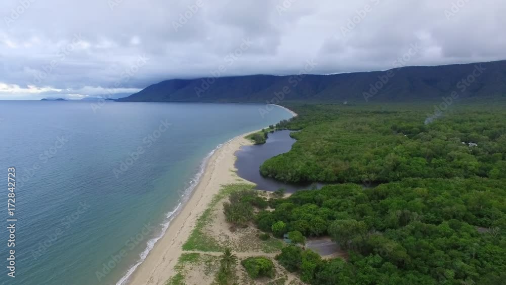A drone shot of an island. The drone move backwards as it take the shot.