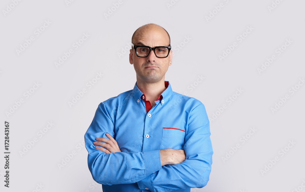 confused bald man wearing glasses isolated confused bald man wearing glasses isolated