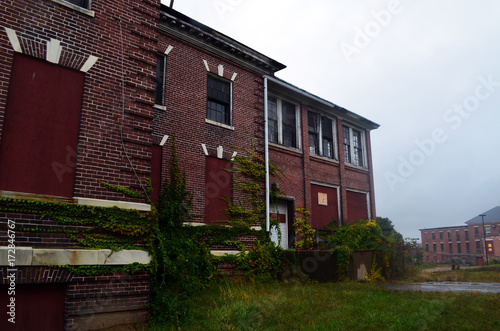 Old abandoned brick hospital building © Alex