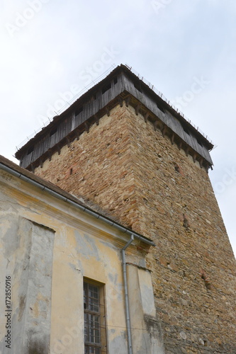 Fortified medieval saxon church in the village Barcut, Bekokten, Brekolten,Transylvania,Romania photo