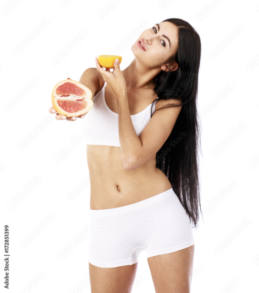 Young beautiful woman in white fitness clothing Young beautiful woman in white fitness clothing