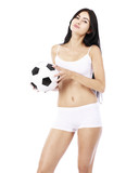Young beautiful woman in white fitness clothing