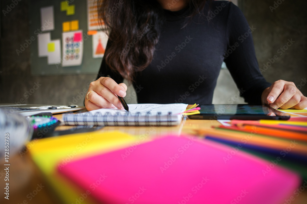 Fototapeta premium stylish designer tailor working at a home studio