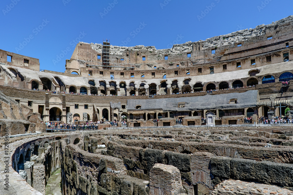Rome, Lazio, Italy. July 25, 2017: Interior views of the Roman Coliseum with many people visiting the interior