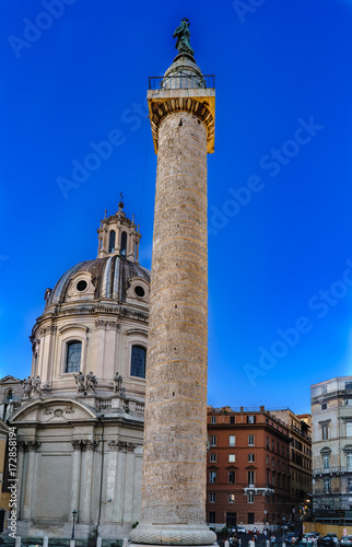 Vertical view of the Trajan column and the church called "SS Nome di Maria" in Rome, Italy