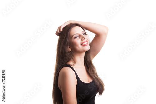 Young pretty teenager girl in the studio making faces isolated over white background