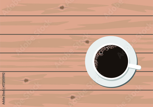 Coffe in white cup on wooden table