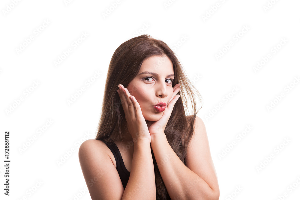 Pretty teenager girl in the studio making faces isolated over white background Pretty teenager girl in the studio making faces isolated over white background