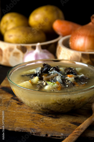 vegetable soup mushrooms glass bowl spoon