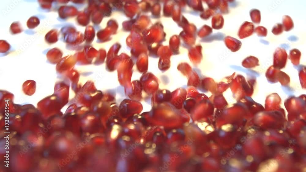 Pomegranate grains on a white background. 2 Shots. Slow motion. Vertical pan. Close-up.
Pomegranate grains are rolling down on a white background and fills all space the frame. Pomegranate grains on a white background. 2 Shots. Slow motion. Vertical pan. Close-up.
Pomegranate grains are rolling down on a white background and fills all space the frame.