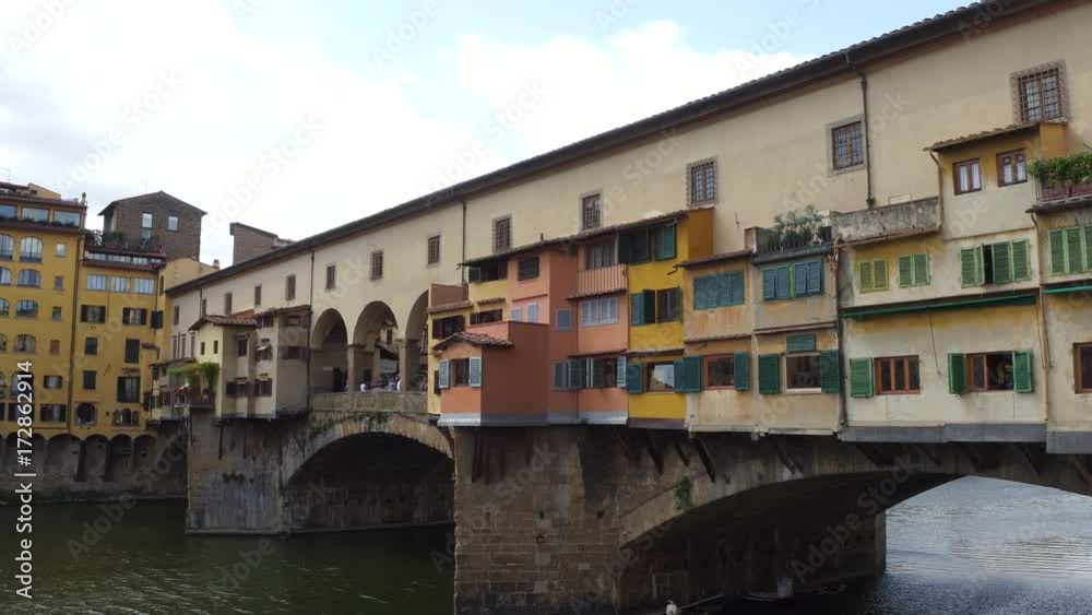 Iconic Vecchio Bridge in Florence over river Arno called Ponte Vecchio - Tuscany Iconic Vecchio Bridge in Florence over river Arno called Ponte Vecchio - Tuscany