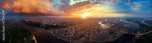 A big panorama of the city of Kiev on Podol at sunset.