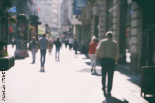  People walking in the street, blurry 