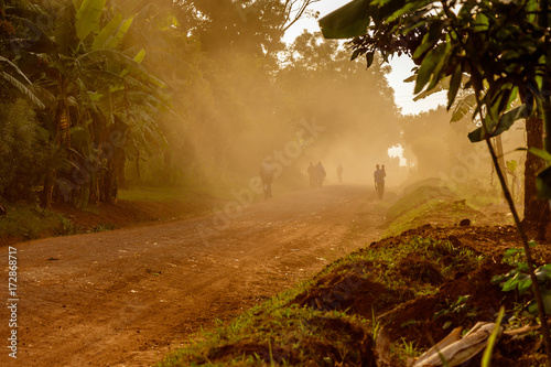 A very duty road around the Sipi falls in the Mount Elgon national park in Uganda photo