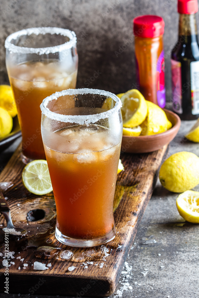 Mexican Michelada. Traditional Latin American mexican spicy refreshing beer  drink with lemon juice, salt, ice tabasco and english worcestershire sauce  Stock Photo | Adobe Stock