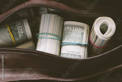 leather bag with cash photo