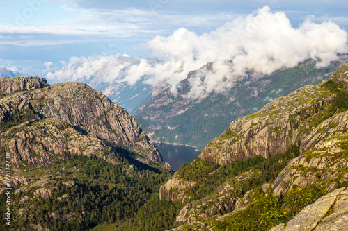 Preikestolen or Prekestolen or Preacher s Pulpit or Pulpit Rock  is a famous tourist attraction in Forsand  Ryfylke  Norway