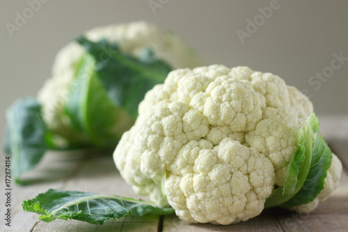 Cauliflower on a wooden background. Rustic style, selective focus.