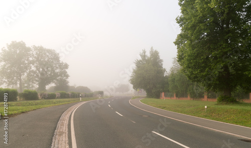 Highway in the early morning in the fog